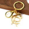 Hochwertiges Gold Silber Roségold -Schlüsselkette Custom Logo Buchstabe Edelstahl Metall -Metallschlüsselkäse Schnittschlüsselkettenzubehör aus.