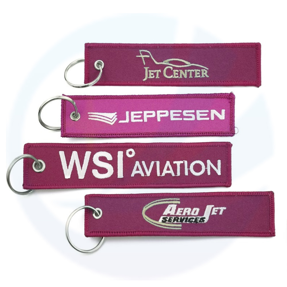 Großhandel Flight Custom Jet Tagschlüsselketten Fabric gewebte Marke Label gewebtes benutzerdefiniertes Logo Key Tag Sticked Key Ring